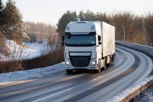 Semi truck driving on a winding highway