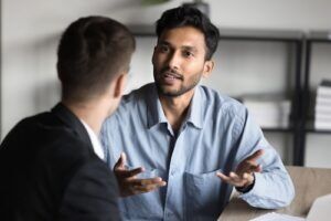 Client talking with a defense lawyer in a meeting
