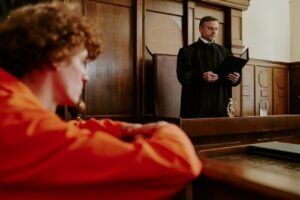 Defendant listening to a judge in a courtroom