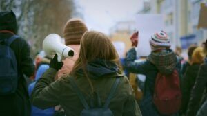 A group of people protesting to symbolize the fact that several proposed Arizona bills threaten peaceful protest and free speech.