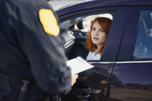 A driver speaking with a police officer during a DUI traffic stop in Tucson.