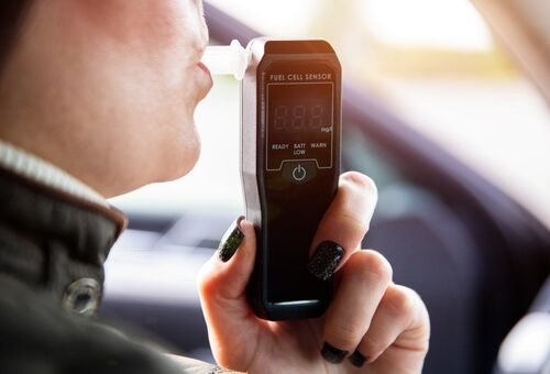 Woman Taking Breathalyzer Sobriety Test Cincinnati DUI