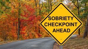 A road with a sobriety checkpoint sign for an article that talks about the top Phoenix sobriety checkpoints. 